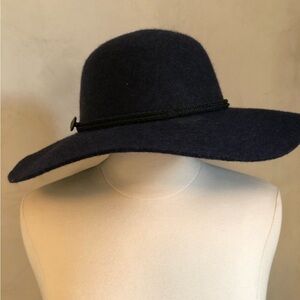 100% Wool Blue Bohemian hat with a black rope and metal charm around the rim